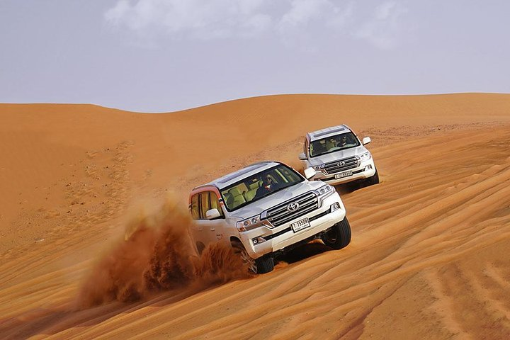 Experience the thrill of dune bashing through Lahbab's stunning red sands followed by a delightful evening filled with cultural activities and a delicious BBQ dinner under the stars.
